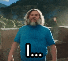 a man with a beard wearing a blue shirt says " i am sorry "