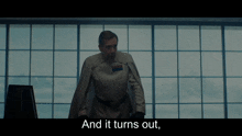 a man standing in front of a window with the words " and it turns out " on the bottom
