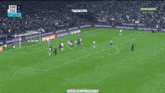 a soccer game is being played in a stadium with advertisements on the sidelines