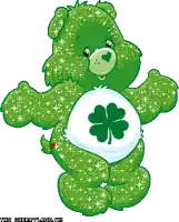 a green care bear with a four leaf clover on his belly