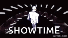 a man in a white suit is standing in front of a stage with the words showtime written in white letters .