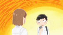 a boy and a girl are standing next to each other with the boy holding a cell phone