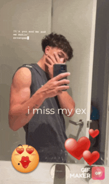 a man taking a picture of himself in a mirror with the words i miss my ex
