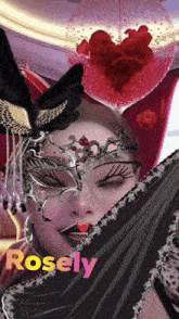 a woman wearing a mask with the name rosely written on the bottom