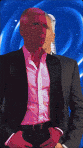 a man in a suit is standing next to another man in a suit