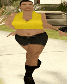 a woman in a yellow top and black shorts is walking down a street