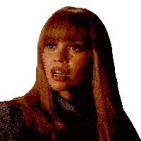a woman with long red hair and bangs is wearing a black top