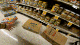 a person is reaching for a box that has the number 1 on it in a grocery store