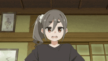a girl with a ponytail and a flower in her hair looks surprised