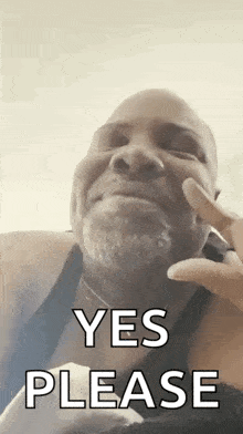 a man with a beard is making a funny face and saying `` yes please '' .