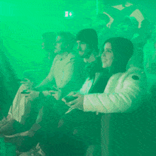 a group of people are playing a video game and the word shagarita is on the bottom left