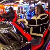 a woman is playing a game in an arcade with a sign that says ' supreme ' on it