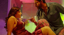 a man and a woman are having sex in a room .