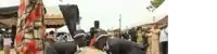 a group of men in top hats are dancing in front of a crowd of people .
