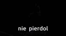 a man with a robotic arm is standing in front of power lines and the words nie pierdol are on the screen