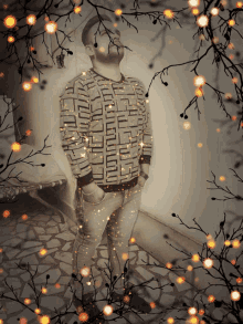a man wearing a sweater that says ' givenchy ' on the front