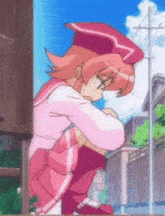 a girl in a pink outfit is kneeling down