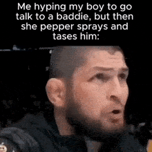 a man with a beard is making a funny face while talking to a baddie .