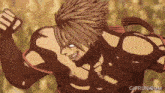 a gif from gifrun.com shows a man in a fighting pose