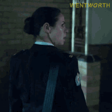 a woman in a police uniform is making a face and the word shit is on the screen