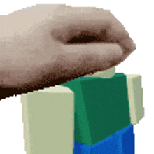 a pixel art drawing of a person 's hand holding a block