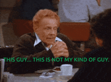 a man sitting at a table talking to a woman with the words this guy this is not my kind of guy below him