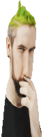 a man with green hair and a beard holds his hand to his face