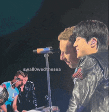 two men on a stage with the words " swallowed the sea " in the corner