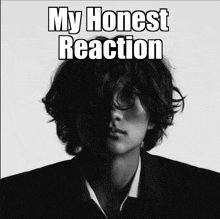 a black and white photo of a man with the words my honest reaction