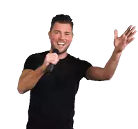 a man in a black shirt is holding a microphone in his hand