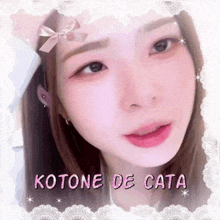 a close up of a woman 's face with the name kotone de cata on the bottom