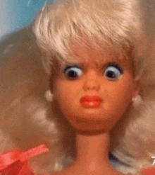 a close up of a doll 's face with the number 7 on it