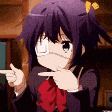 a girl with a bandage on her eye is pointing her finger at something .