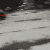 a blurred image of a person 's face with a red arrow pointing to it