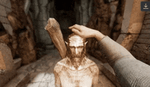 a person touching a statue with an arrow pointing up