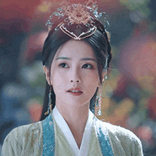 a close up of a woman wearing a crown