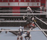 a wrestling ring with a sign that says " performance center "