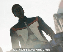 a man in a superhero costume says " quit messing around "