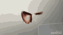a drawing of a man 's face with the words made in animatica below it