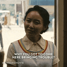 a woman in a white shirt says " why you got to come here bringing trouble ? "