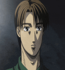 a close up of a man 's face with a green shirt