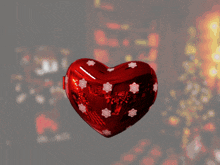 a heart shaped box with a picture of a man in a santa hat on it