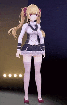 a girl with long blonde hair is standing on a stage in a dark room .