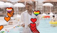 a man in a white shirt is standing next to a pool with a rainbow heart on his shoulder
