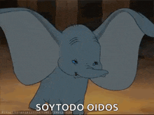 dumbo from the disney movie dumbo is flying through the air with his wings outstretched and says soytodo oidos .