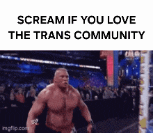 a man is screaming in a wrestling ring with the words scream if you love the trans community .