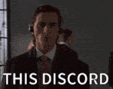 a man in a suit and tie is wearing headphones and the words this discord are above him
