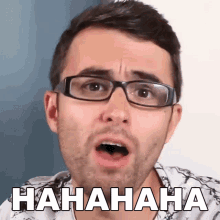 a man wearing glasses is making a funny face with the word  hahaha written on the bottom
