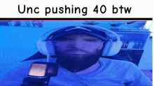 a man wearing headphones and a hat with the words unc pushing 40 btw on the bottom