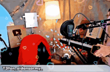 a person is playing a keyboard in front of a microphone with the hashtag t3fan_aidansarmy